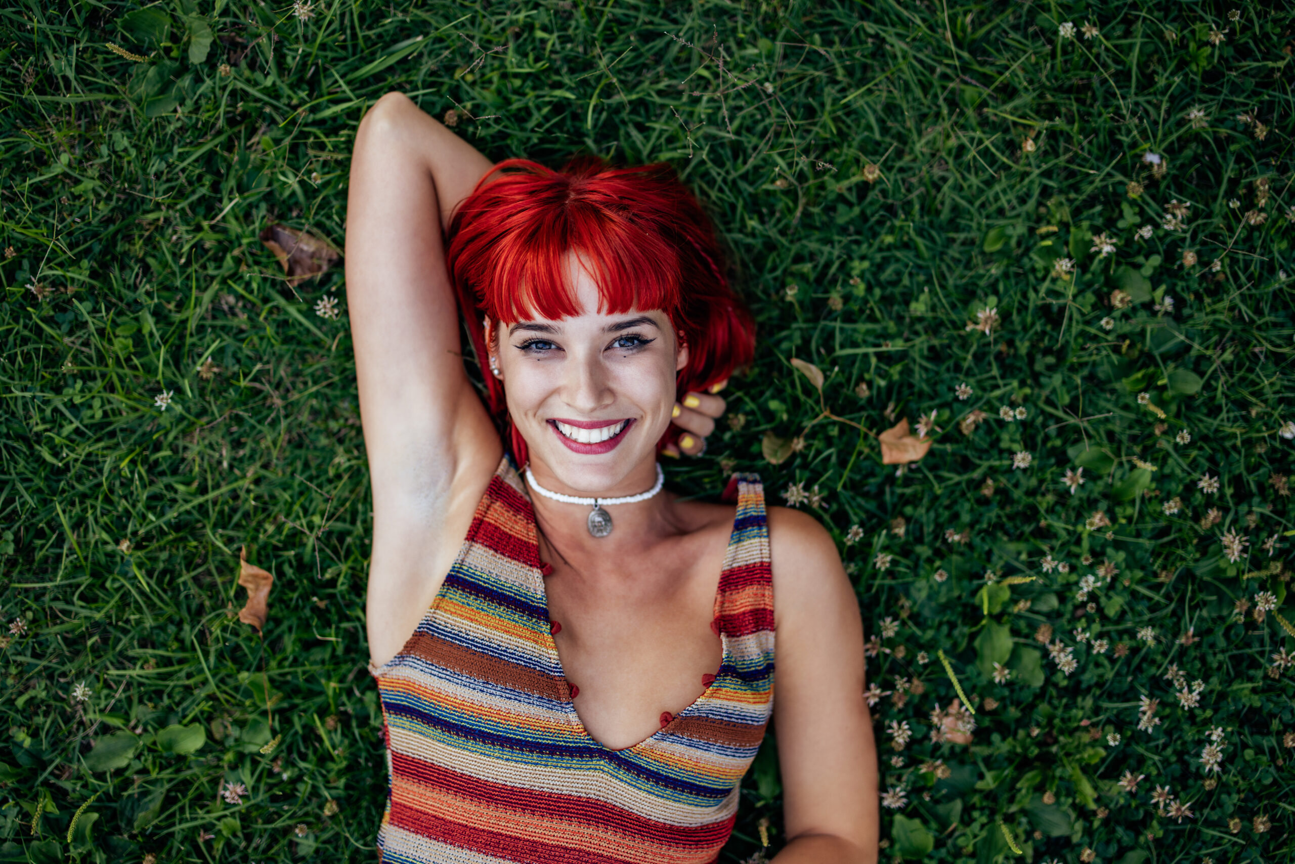 Fiery First Date Ideas for Redheads to Kindle Chemistry and Capture Hearts - woman relaxing in grass