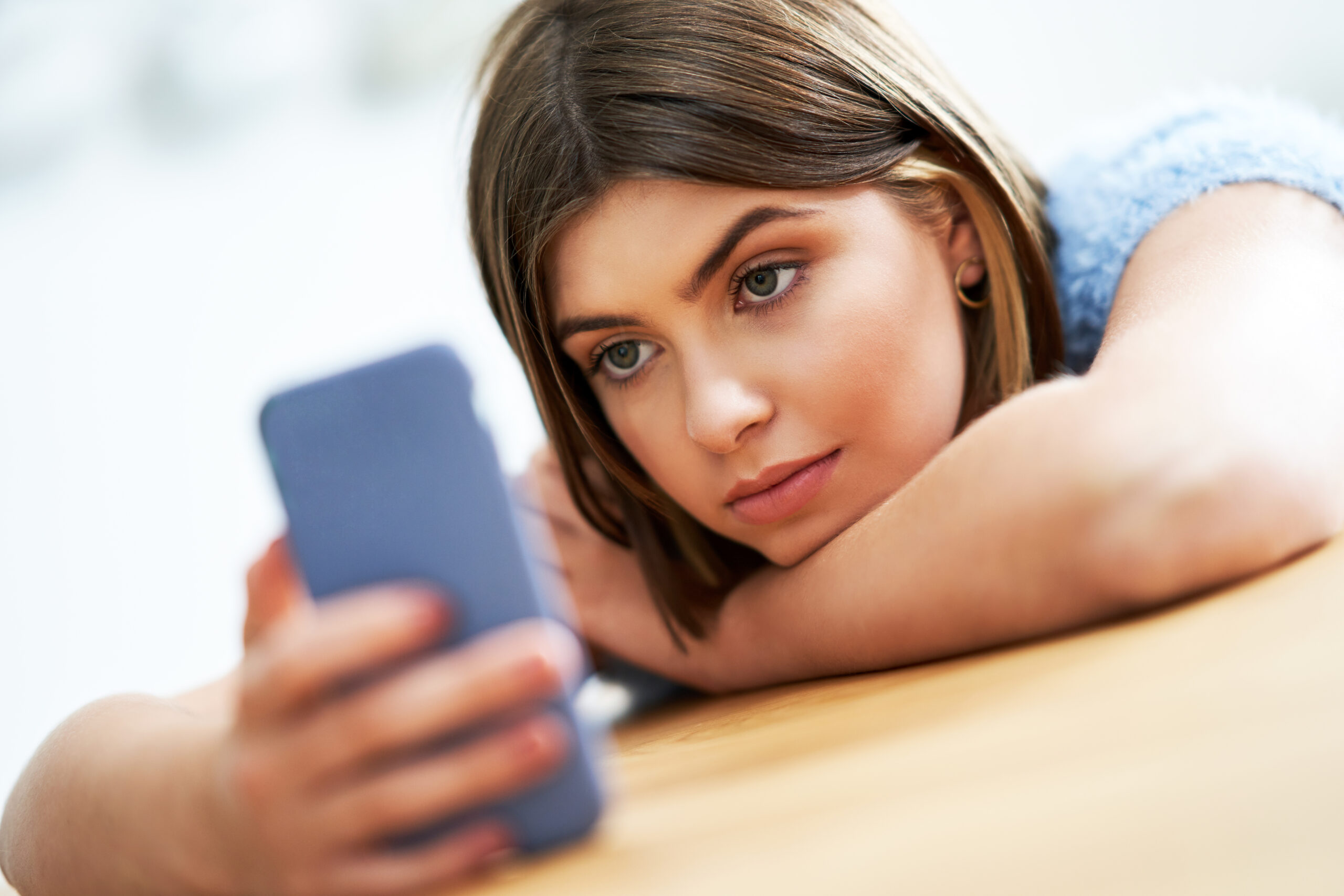 How to Spot Obsessive Ex-Girlfriend Behaviour Before It Goes Too Far - girl texting in bed